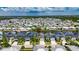 Aerial view of the house and surrounding neighborhood, with waterways nearby at 6532 Simone Shores Cir, Apollo Beach, FL 33572