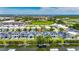 Aerial view of modern waterfront homes with pools and canal access, showcasing the community's layout at 6532 Simone Shores Cir, Apollo Beach, FL 33572