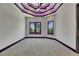 Elegant bedroom features contemporary ceiling, recessed lighting, and violet LED accent lighting around windows at 6532 Simone Shores Cir, Apollo Beach, FL 33572