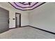Spacious bedroom featuring modern ceiling design, recessed lighting, and violet LED accent lighting at 6532 Simone Shores Cir, Apollo Beach, FL 33572