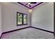 Bedroom featuring neutral carpet and paint, natural light, and modern ceiling fan at 6532 Simone Shores Cir, Apollo Beach, FL 33572