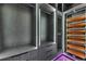 Spacious closet with custom shelving, drawers, and orange dividers with LED lighting for ample storage and organization at 6532 Simone Shores Cir, Apollo Beach, FL 33572