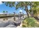 Scenic waterfront property with a private boat dock and lift on a peaceful canal, ideal for relaxation at 6532 Simone Shores Cir, Apollo Beach, FL 33572
