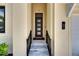 Close-up of the home's entrance showcasing a modern door and tiled steps at 6532 Simone Shores Cir, Apollo Beach, FL 33572