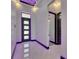 Modern foyer features sleek marble flooring, modern lighting, and an open entry at 6532 Simone Shores Cir, Apollo Beach, FL 33572