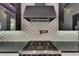 Close up of kitchen with cooktop and backsplash at 6532 Simone Shores Cir, Apollo Beach, FL 33572