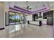 Contemporary kitchen with sleek white cabinets, black countertops, and an open layout perfect for entertaining at 6532 Simone Shores Cir, Apollo Beach, FL 33572