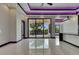 Expansive living area featuring sleek tile flooring and large glass doors providing ample natural light at 6532 Simone Shores Cir, Apollo Beach, FL 33572