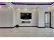 Bright and airy living room featuring a modern fireplace, sleek design, and ample natural light at 6532 Simone Shores Cir, Apollo Beach, FL 33572