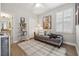 Comfortable bedroom featuring a daybed, decorative pillows, a plush rug, and a sunny window with shutters at 702 34Th N Ave, St Petersburg, FL 33704