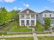 Beautiful two-story home with manicured lawn, fenced yard, dual balconies and charming curb appeal at 702 34Th N Ave, St Petersburg, FL 33704