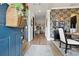 Inviting foyer featuring hardwood floors, elegant wallpaper, and a view into the living spaces at 702 34Th N Ave, St Petersburg, FL 33704
