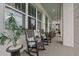 Inviting front porch with rocking chairs and a view of the lovely landscaped front yard at 702 34Th N Ave, St Petersburg, FL 33704