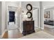Inviting hallway with wood floors, decorative mirrors, and doorways to other rooms in the house at 702 34Th N Ave, St Petersburg, FL 33704