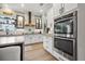 Bright kitchen with stainless steel appliances, white cabinets and double oven at 702 34Th N Ave, St Petersburg, FL 33704