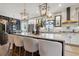 Charming kitchen featuring a large island, modern lighting, and access to a living area at 702 34Th N Ave, St Petersburg, FL 33704