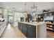 Bright open kitchen featuring a large island with seating and open floor plan at 702 34Th N Ave, St Petersburg, FL 33704