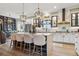 Bright and modern kitchen with island seating, stainless steel appliances, and stylish decor at 702 34Th N Ave, St Petersburg, FL 33704