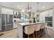 Well-equipped kitchen with white cabinets, stainless steel appliances, and a view of the island at 702 34Th N Ave, St Petersburg, FL 33704