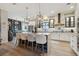 Spacious kitchen featuring a large island with seating and modern pendant lighting at 702 34Th N Ave, St Petersburg, FL 33704