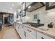 Elegant kitchen with white cabinetry, stainless steel appliances, and geometric backsplash for a modern cooking experience at 702 34Th N Ave, St Petersburg, FL 33704