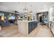 Spacious kitchen island featuring modern finishes, ample storage, and a view of the open-concept living area at 702 34Th N Ave, St Petersburg, FL 33704