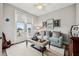 Cozy living room with neutral walls, bright sunlight, and comfortable seating at 702 34Th N Ave, St Petersburg, FL 33704