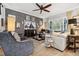 Comfortable living room boasts stylish seating, a ceiling fan, and contemporary decor at 702 34Th N Ave, St Petersburg, FL 33704