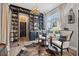 Elegant living room featuring custom shelving, comfortable seating, and natural light, creating a welcoming ambiance at 702 34Th N Ave, St Petersburg, FL 33704
