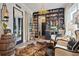 Stylish living room with custom shelving, ample seating, and unique decor, creating an inviting space at 702 34Th N Ave, St Petersburg, FL 33704