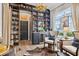 Living room with stylish shelving and a wine bar, perfect for entertaining guests and enjoying fine spirits at 702 34Th N Ave, St Petersburg, FL 33704
