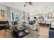 Open-concept living area with large windows, comfortable sofa, and access to the kitchen at 702 34Th N Ave, St Petersburg, FL 33704