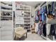 Walk-in closet with custom shelving, shoe racks, and clothing rods for optimal organization and storage at 702 34Th N Ave, St Petersburg, FL 33704