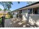 Backyard deck with dark trim and easy access to home at 7461 Pescador Pl, Seminole, FL 33772