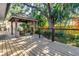 Secluded backyard deck featuring a charming gazebo, perfect for outdoor relaxation at 7461 Pescador Pl, Seminole, FL 33772