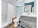 Modern bathroom features a walk-in shower, stylish vanity, and contemporary finishes at 7461 Pescador Pl, Seminole, FL 33772