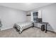 Functional bedroom with a desk, natural light, and modern decor at 7461 Pescador Pl, Seminole, FL 33772