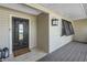 Charming front porch with decorative lantern and 'Welcome' mat, inviting guests at 7461 Pescador Pl, Seminole, FL 33772