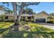 Charming single-story home with mature landscaping and a well-maintained front yard at 7461 Pescador Pl, Seminole, FL 33772