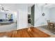 Spacious living room with hardwood floors flowing into an adjacent dining area at 7461 Pescador Pl, Seminole, FL 33772