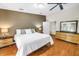 Tranquil main bedroom with hardwood floors, neutral walls, and ample natural light at 7461 Pescador Pl, Seminole, FL 33772
