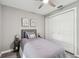 Comfortable bedroom featuring hardwood floors, a closet, and neutral paint at 807 Illinois Ave, Palm Harbor, FL 34683