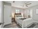 Serene bedroom features a soothing color palette, hardwood floors, and a cozy bed at 807 Illinois Ave, Palm Harbor, FL 34683