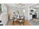 Cozy dining area showcasing a round table, modern decor, and seamless flow to the kitchen at 807 Illinois Ave, Palm Harbor, FL 34683