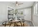Dining area featuring modern furnishings, natural light from shuttered windows, and stylish decor at 807 Illinois Ave, Palm Harbor, FL 34683