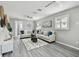 Bright living room featuring hardwood floors, neutral paint, and stylish modern decor at 807 Illinois Ave, Palm Harbor, FL 34683