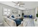 Inviting living area featuring hardwood floors, plantation shutters, and tastefully selected furniture at 807 Illinois Ave, Palm Harbor, FL 34683