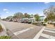 Charming street with a beautiful building featuring outdoor seating, enhanced by lush landscaping and ample parking at 807 Illinois Ave, Palm Harbor, FL 34683