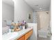 Full bathroom with a shower-tub combo and a vanity for ample counter space at 8415 Edgewater Place Blvd, Tampa, FL 33615