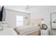 Comfortable bedroom featuring a queen-size bed, coordinated linens, and ample natural light at 8415 Edgewater Place Blvd, Tampa, FL 33615